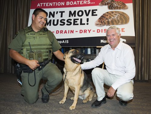 Natural resource officer Chad Moir (left), canine-unit member Fauna and conservation and water stewardship minister Gord Mackintosh at the Legislative Building on Friday as the province announces Don't Move A Mussel update and how the canine unit will assist with monitoring zebra mussels in Manitoba's lakes. Sarah Taylor / Winnipeg Free Press August 29, 2014
