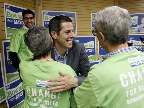 Mayoral candidate Brian Bowman with supporters after a briefing for media in his campaign office on Portage Ave. Friday morning. Bart Kives story. Wayne Glowacki/Winnipeg Free Press August 29 2014