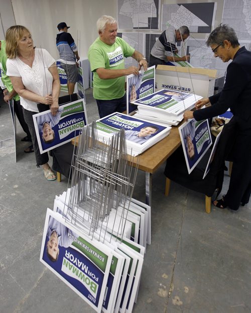 Mayoral candidate Brian Bowman's volunteers prepare election signage at campaign hq of Portage Ave. that can go up on lawns Saturday. Bart Kives story. Wayne Glowacki/Winnipeg Free Press August 29 2014