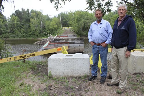 014- 019 - Harm Sikkenga and Cal Kirby have put up their own money to help rebuild the bridge that would reconnect them to the town of Whitemouth. BILL REDEKOP/WINNIPEG FREE PRESS Aug 29,2014
