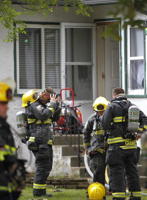 Winnipeg Fire Fighters at the scene of a basement fire in a single storey house in the 300 block on Campbell St. Friday afternoon. No injuries. Wayne Glowacki/Winnipeg Free Press August 29 2014