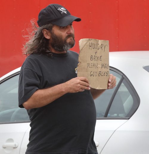 Brian Minchin is on the corner of Osborne St N and Broadway asking motorist for money- See Randy Turner  story- Aug 29, 2014   (JOE BRYKSA / WINNIPEG FREE PRESS)