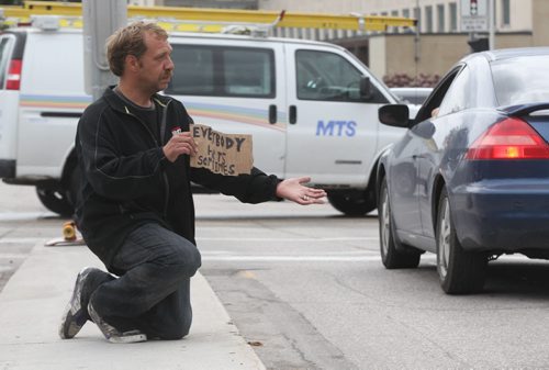 Kevin Jacques Leblanc is on the corner of Osborne St N and Broadway asking motorist for money- See Randy Turner  story- Aug 29, 2014   (JOE BRYKSA / WINNIPEG FREE PRESS)