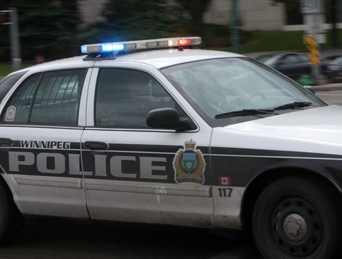 For Files- A Winnipeg Police cruiser flies through downtown Winnipeg with lights and sirens responding to a emergency call- For files- Aug 29, 2014   (JOE BRYKSA / WINNIPEG FREE PRESS)
