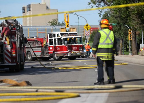 Emergency personal block traffic on Main Street at Higgins in both directions due to a carbon monoxide leak.    Aug 30, 2014 Ruth Bonneville / Winnipeg Free Press   Ruth Bonnevilles