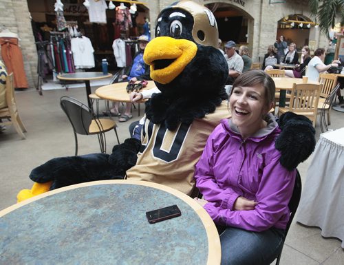 August 31, 2014 - 140825  -  Bommer gets cozy with Sandy Broesky as she joined about thirty Winnipeg Blue Bomber fans to watch the Labour Day Classic at The Forks, Sunday, August 31, 2014.  John Woods / Winnipeg Free Press