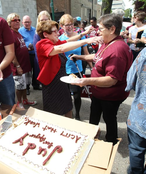 Mayoral candidate Judy Wasylycia-Leis   hugs her volunterrs after she cut a campaign cake outside her campaign office on Portage Ave Tuesday afternoon after her announcement today- Standup Photo- Sept 02, 2014   (JOE BRYKSA / WINNIPEG FREE PRESS)