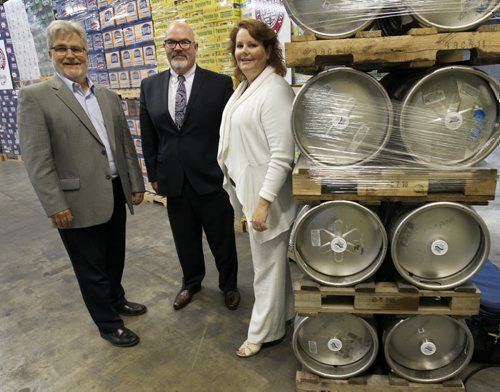 Opening of new customs bonded warehouse at WETT Sales & Distribution at CentrePort.- L to R , Bill Gould, President, WETT Sales & Distribution, Robert Holmberg of Manitoba Liquor and Lotteries, and Diane Gray, President and CEO, CentrePort Canada Inc. -See Martin Cash story- Sept 03, 2014   (JOE BRYKSA / WINNIPEG FREE PRESS)