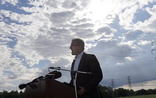 Against Thursdays dark clouds and sun ,he wonders how  major projects like the BRT will be financed . ­Mayor Candidate Gord Steeves challenges  Judy Wasylycia -Leis  BRT  financing at a news conference  held  on the Parker Lands  an area that may be used for the BRT .  SEPT  4 2014 / KEN GIGLIOTTI / WINNIPEG FREE PRESS