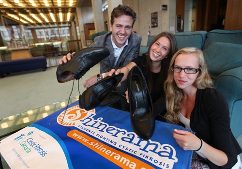 Cystic Fibrosis Charity Co-Chairs, Commerce Students Association -  Chris Kirk-Fisher (guy on left), Alissa Smith (centre) and 16-year-old Kayla Hodgins who was diagnosed with CF when she was a infant, get ready for the 50th National anniversary and the 29th annual U of M campaign for Shinearama which  shines peoples shoes to raise money for Cystic Fibrosis. Event took place at City Hall Thursday.  Standup  Sept 04.  2014 Ruth Bonneville / Winnipeg Free Press   Ruth Bonnevilles