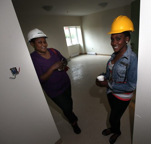 Sisters Doreen Wasuk (left) and Nancy Lado got to inspect their new four bedroom apartment at St. Matthews Anglican Church Thursday. They will be moving in with Doreen's four children. Renovations turning the century old church into an apartment block for low-income housing and a community hub are now completed people are moving into the church in the next weeks. See Brenda Suderman story. September 4, 2014 - (Phil Hossack / Winnipeg Free Press)
