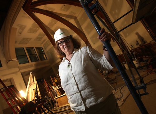 Rev. Cathy Campbell poses in the new Sanctuary at St. Matthews Anglican Church. Renovations turning the century old church into an apartment block for low-income housing and a community hub are now completed people are moving into the church in the next weeks. See Brenda Suderman story. September 4, 2014 - (Phil Hossack / Winnipeg Free Press)