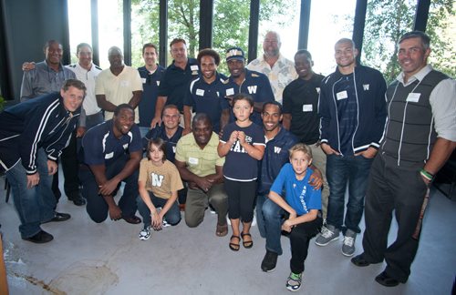 Current and former Winnipeg Blue Bombers players came out to support Variety, the Childrens Charity at the Hearts of Blue and Gold Dinner at Earls St. Vital. More than $22,000 was raised. The next dinner is Oct. 28 at Earls on Main Street. Pictured are Bombers past and present with Variety ambassadors Ty (from left), Emma and Todd. (John Johnston / Winnipeg Free Press)