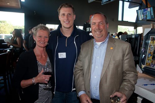 Current and former Winnipeg Blue Bombers players came out to support Variety, the Childrens Charity at the Hearts of Blue and Gold Dinner at Earls St. Vital. More than $22,000 was raised. The next dinner is Oct. 28 at Earls on Main Street. Pictured, from left, are Shelly McIntosh, Bombers quarterback Drew Willy and Larry McIntosh of Peak of the Market. (John Johnston / Winnipeg Free Press)
