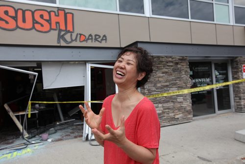 Kyungjae Lee, owner of Sushi Kudara, describes how she was setting a table in her restaurant on Academy seconds before a car came smashing through the window Saturday afternoon.  Fortunately no one was injured in the accident.  See Mary Agnes Story.   Sept 04.  2014 Ruth Bonneville / Winnipeg Free Press   Ruth Bonnevilles