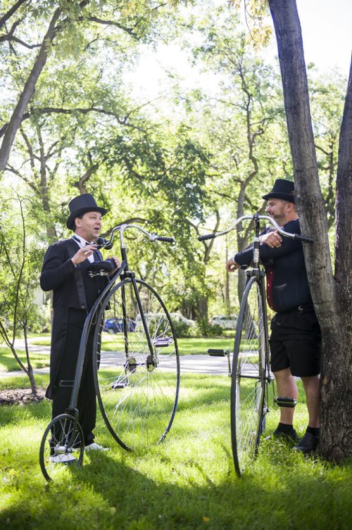 140907 Winnipeg - DAVID LIPNOWSKI / WINNIPEG FREE PRESS  Martin Barnes (left) and Curt Toews speak with their Penny-farthings in Vimy Ridge Park Sunday afternoon as the annual tweed ride takes off. The tweed ride is part of Ciclovia, which is part of Manyfest.