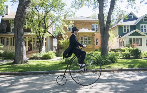 140907 Winnipeg - DAVID LIPNOWSKI / WINNIPEG FREE PRESS  Martin Barnes rides his Penny-farthing in Vimy Ridge Park Sunday afternoon as the annual tweed ride takes off. The tweed ride is part of Ciclovia, which is part of Manyfest.