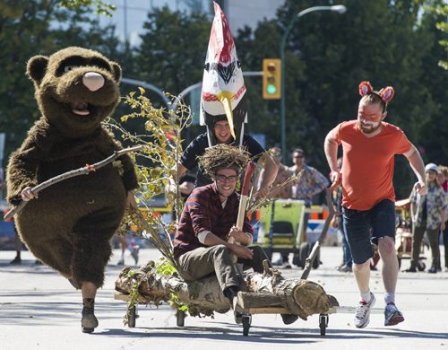 140907 Winnipeg - DAVID LIPNOWSKI / WINNIPEG FREE PRESS  Team Wimble Jack and the Timber Tots consisting of: (L-R) Aaron Zeghers, Ted Barker (sitting) Toby Gillies, and Ryan Simmons compete in the Soapbox Derby which is a fundraiser for aceartinc. during Manyfest Sunday afternoon.