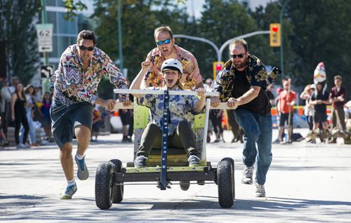 140907 Winnipeg - DAVID LIPNOWSKI / WINNIPEG FREE PRESS  Team Sun of Boom consisting of: (L-R) Andrew Moreau, Ray Karasevich, Rosemary Dohan (sitting), and Chris Cichelly compete in the Soapbox Derby which is a fundraiser for aceartinc. during Manyfest Sunday afternoon.