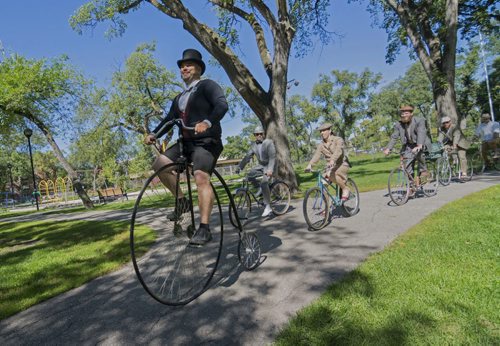 140907 Winnipeg - DAVID LIPNOWSKI / WINNIPEG FREE PRESS  Curt Toews rides his Penny-farthing in Vimy Ridge Park Sunday afternoon as the annual tweed ride takes off. The tweed ride is part of Ciclovia, which is part of Manyfest.