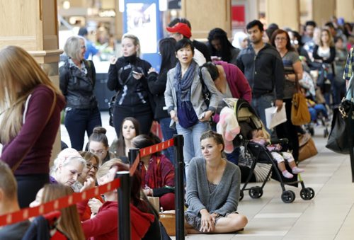 Hundreds wait in line some since 7AM in the Polo Park Shopping Centre for the grand opening of the new H&M store. Geoff Kirbyson story Wayne Glowacki/Winnipeg Free Press Sept.10 2014