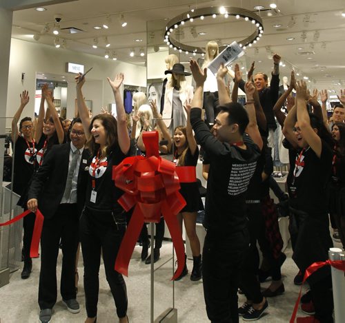 Excited H&M staff celebrate the opening of the new store in the Polo Park Shopping Centre Wednesday morning. Geoff Kirbyson story. Wayne Glowacki/Winnipeg Free Press Sept.10 2014