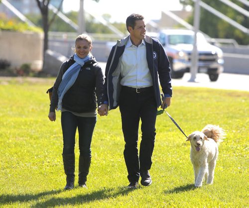 Brian Bowman, his wife Tracy and his dog Indiana at a press announcement in the park on the Red River across the street from the new Human Rights Museum. BORIS MINKEVICH / WINNIPEG FREE PRESS  Sept. 12, 2014