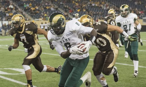 140912 Winnipeg - DAVID LIPNOWSKI / WINNIPEG FREE PRESS  Regina Rams Richard Sindani (#8) runs against the Manitoba Bisons Friday night at Investors Group Field.