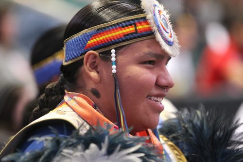 Dyson Brown wears his fancy dress costume while drumming and singing at  Manito Ahbee competition at  MTS Centre Saturday.  Sept 13,  2014 Ruth Bonneville / Winnipeg Free Press
