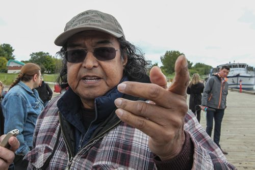 Percy Ningewance talks about having dragged river and lake bottoms before and thinks it will be no different in the Red River. A pipe and smudging ceremony took place Sunday afternoon at the Alexander Docks in honour of missing and slain aboriginal women. 140914 - Sunday, September 14, 2014 -  (MIKE DEAL / WINNIPEG FREE PRESS)