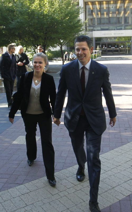 Brian Bowman and  wife Tracy walk to the  City Clerk's office Monday so Brian can  file his mayoral nomination papers.   Wayne Glowacki/Winnipeg Free Press Sept.15  2014
