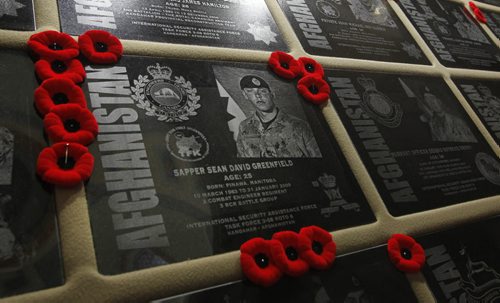 The plaque that is part of the Afghanistan Memorial Vigil on display at the Manitoba Legislative Bld. for Sean David Greenfield,25, who was killed when the armoured vehicle he was inside in 2009 struck a roadside bomb in the volatile Zhari district.  The Vigil is built from the recovered memorial plaques from Kandahar Air Field cenotaph, the Vigil display focuses on fallen Canadians, including the 158 soldiers, a Canadian diplomat, contractor, journalist as well as 40 United States Armed Forces personnel attached to the Canadian Forces.Larry Kusch story Wayne Glowacki/Winnipeg Free Press Sept.16  2014