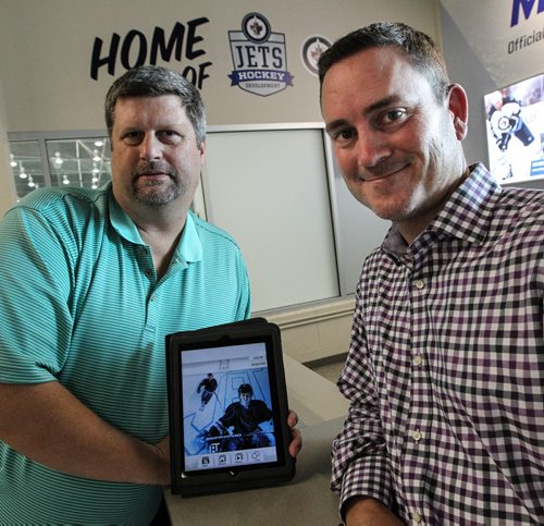 John Trouba (left) and Jake Herberholz (right) from Compete Communications are launching a Jacob Trouba app which by all accounts will be the first time an NHL player will have his own app. 140916 September 16, 2014  Mike Deal / Winnipeg Free Press
