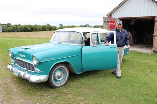 Albert Thompson's eclectic museum collection is going up for auction next month in Ste. Rose. It includes antique vehicles and farm equipment, as well as his own inventions.  057 -058 - Albert Thompson and his 1955 Chevy.  BILL REDEKOP/WINNIPEG FREE PRESS Sept 16,2014