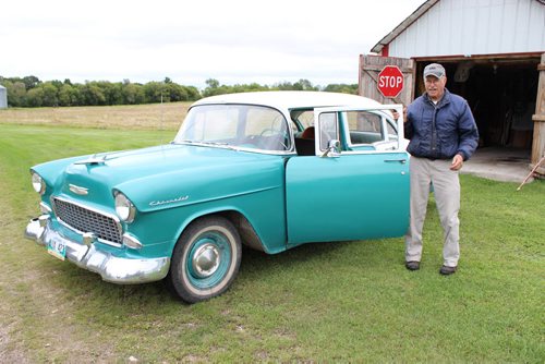 Albert Thompson's eclectic museum collection is going up for auction next month in Ste. Rose. It includes antique vehicles and farm equipment, as well as his own inventions. 057 -058 - Albert Thompson and his 1955 Chevy.  BILL REDEKOP/WINNIPEG FREE PRESS Sept 16,2014