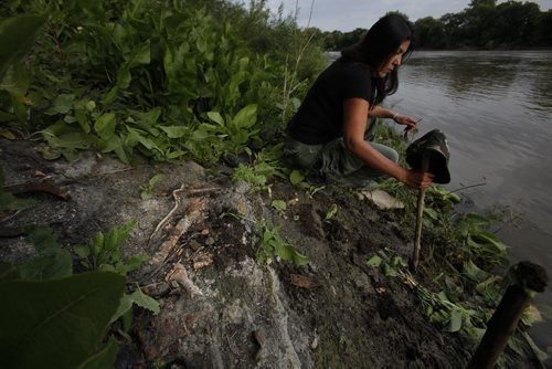 September 16, 2014 - 140916  - Jo Seenie came in from Roseau River to search for missing women in the Red River Tuesday September 16, 2014. She found some bones (foreground) along the shore at the end of Annabella St. John Woods / Winnipeg Free Press