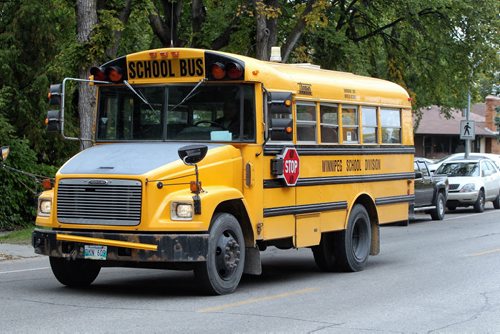 Winnipeg School Division buses on Harrow Street Wednesday afternoon.  140917 September 17, 2014 Mike Deal / Winnipeg Free Press