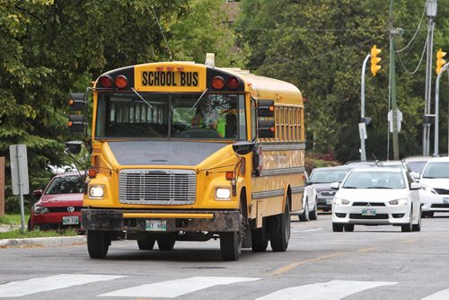 Winnipeg School Division buses on Harrow Street Wednesday afternoon.  140917 September 17, 2014 Mike Deal / Winnipeg Free Press