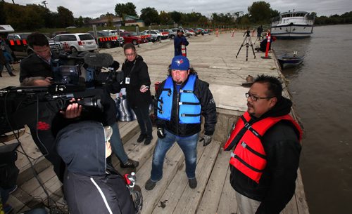 Grand Chief Derek Nepinak (center in blue pfd) talks to the media as a search for murdered and missing women got underway at the Alexander Docks Wednesday. See Ashley Prest's story. September 17, 2014 - (Phil Hossack / Winnipeg Free Press)