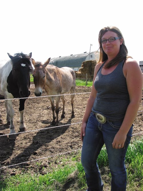 Canstar Community News July 30, 2013 - Owner of Dacotah Performances Horses Sarah Southwell with one of the horses and a henny at her stable in Dacotah. (ANDREA GEARY/CANSTAR COMMUNITY NEWS)