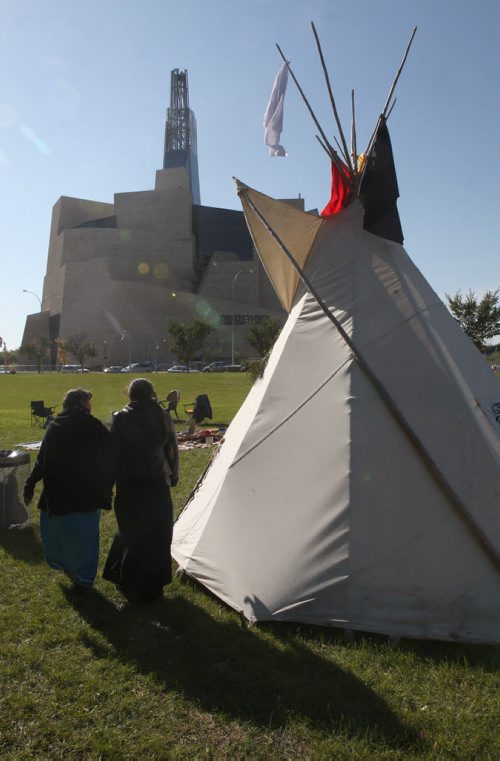 A group of First Nations people, including Gerry Shingoose, Lorraine Clements who reside in Winnipeg have set up a small teepee to honour  the people of their past near the site of the Canadian Museum for Human Rights- They will be smudging the area to prepare the area for the museums opening tomorrow- A morning ceremony will be held a 9 AM which all are welcome-  Standup Photo- Sept 18, 2014   (JOE BRYKSA / WINNIPEG FREE PRESS)