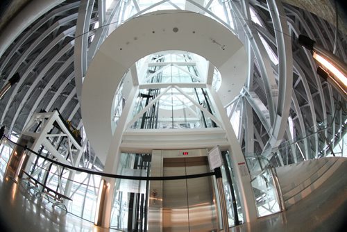 Tour of CMHR - A beautiful grand staircase leading to  brightly lit Tower of Hope.    Sept 17,  2014 Ruth Bonneville / Winnipeg Free Press