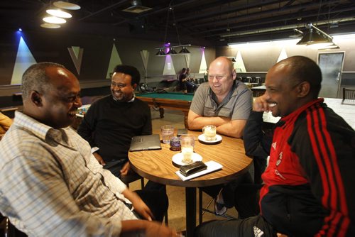 Sunday/XTRA/ This City.From left, regulars Misah Daba, Endale Negussie, John Czezowski and Amare Gebru at the X-Cue's Billiards & Café. This City story by Dave Sanderson. Wayne Glowacki/Winnipeg Free Press Sept.18 2014