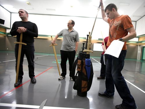 Swords arrive in a golf bag which instructor Cody Skillen (right in orange) carries to the Lord Robertson Community Center where he teaches the art of the German Long Sword. Dave Sanderson's story. September 17, 2014 - (Phil Hossack / Winnipeg Free Press)