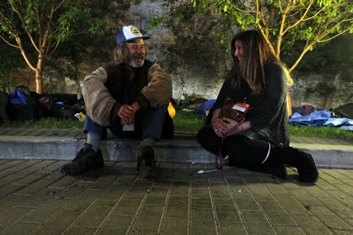 Rob shares a smile with Lisa Webinger from Recon Controls. Lisa is participating in the sleep out corporate challenge at Portage and Main.  BORIS MINKEVICH / WINNIPEG FREE PRESS  Sept. 18, 2014