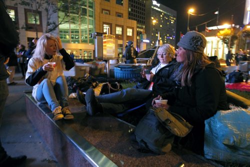 Federal Minister Candice Bergen, Joanne Buth, former senitor and now CEO of Canadian International Grains Institute(CIGI), and Caroline Hiebert, with Bergen. They were participating in the sleep out corporate challenge at Portage and Main.  BORIS MINKEVICH / WINNIPEG FREE PRESS  Sept. 18, 2014