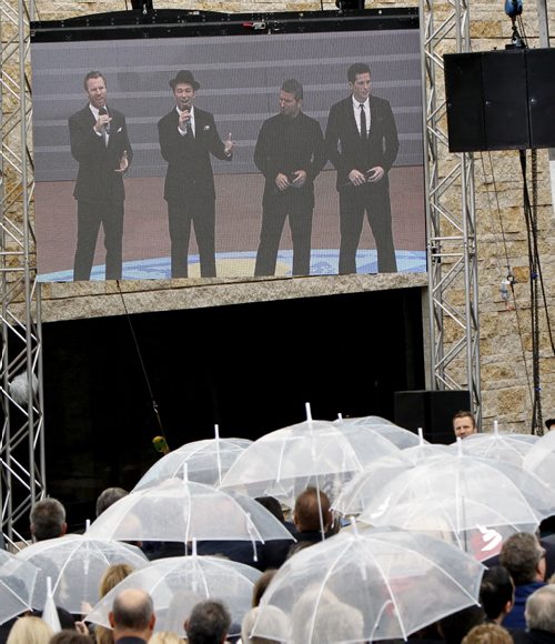 The Tenors perform for the crowd during a light rain shower at the Canadian Museum for Human Rights official opening ceremonies Friday. Mary Agnes Welch story.¤Wayne Glowacki/Winnipeg Free Press Sept.19 2014