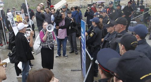 Winnipeg Police watch demonstrators outside the Canadian Museum for Human Rights  official during opening ceremonies Friday. Mary Agnes Welch story.¤Wayne Glowacki/Winnipeg Free Press Sept.19 2014