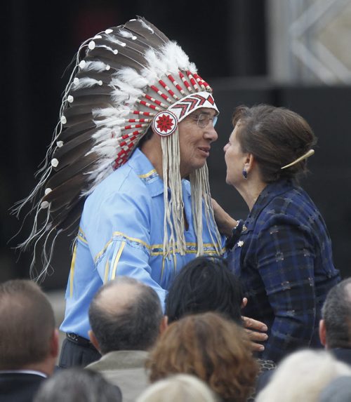 Dr.Wilton Littlechild, Member of the Board of Trustees,Canadian Museum for Human Rights embraces Gail Asper at the opening of the Canadian Museum for Human Rights ceremonies Friday. Mary Agnes Welch story.¤Wayne Glowacki/Winnipeg Free Press Sept.19 2014