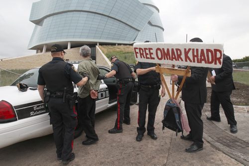 A protestor is arrested by Winnipeg Police Friday afternoon while protesting outside the Canadian Museum of Human Rights- Today was the museums opening day-Breaking News- Sept 19, 2014   (JOE BRYKSA / WINNIPEG FREE PRESS)